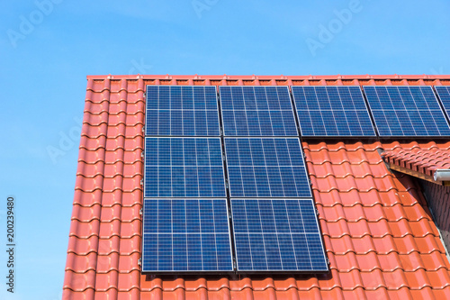 red roof with photovoltaic or solar panels