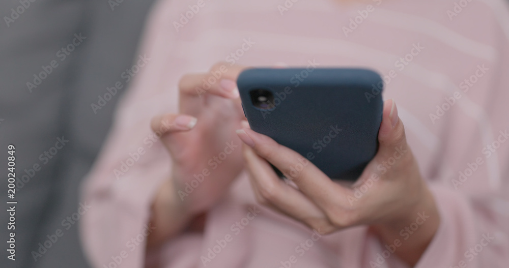 Hand holding cellphone Hand holding cellphone
