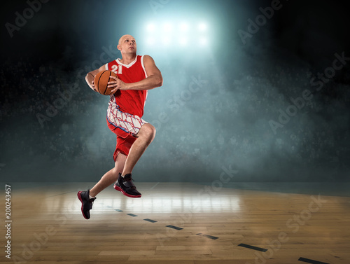  Basketball Player in dynamic action with ball