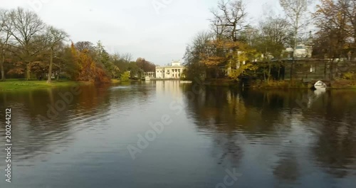 Flying Over The Lake To The Right In Lazienki Park. A View On A Palace