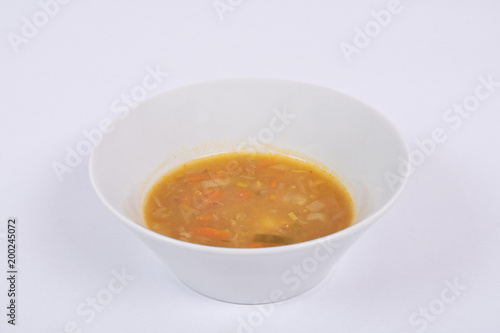 Potato soup with flakes on a white