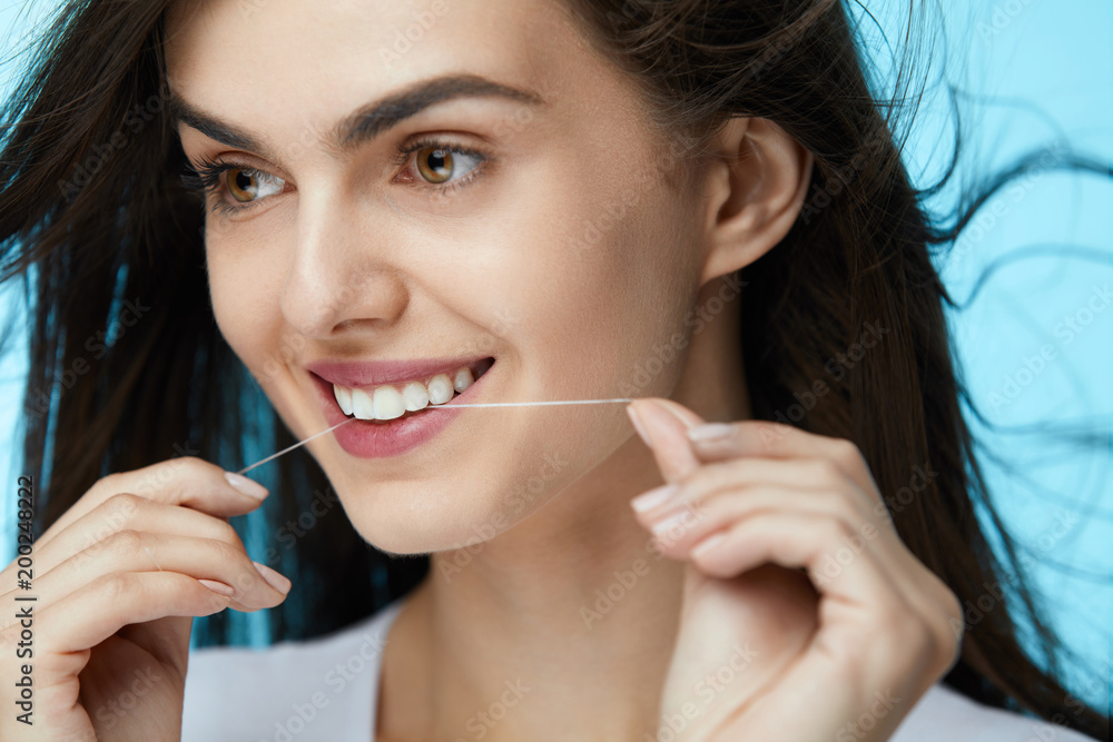 Dental Care. Beautiful Woman Flossing Teeth Dental Care. Beautiful Woman Flossing Teeth