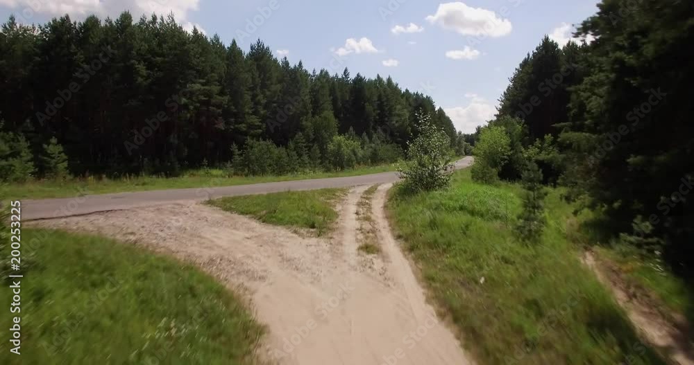 Aerial view on a small forest road Aerial view on a small forest road