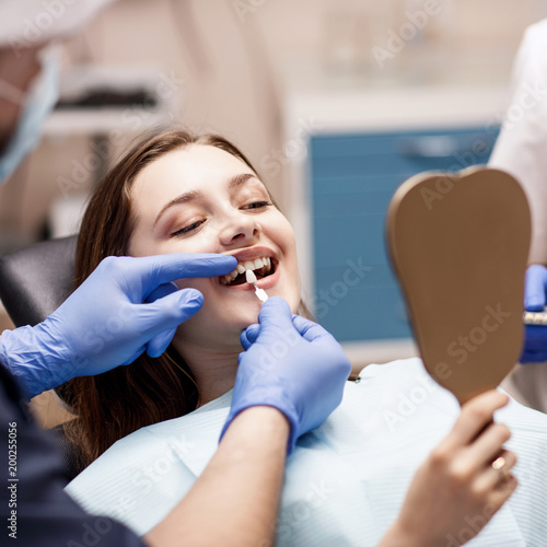 Patient's teeth shade with samples for bleaching treatment.