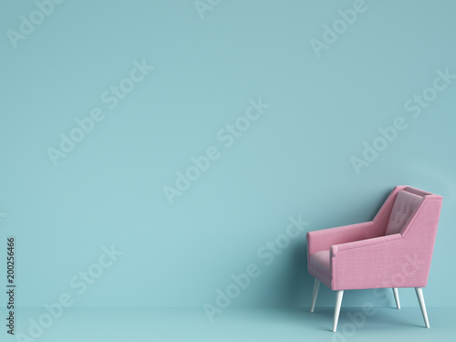 Classic pink chair on blue background with copy space