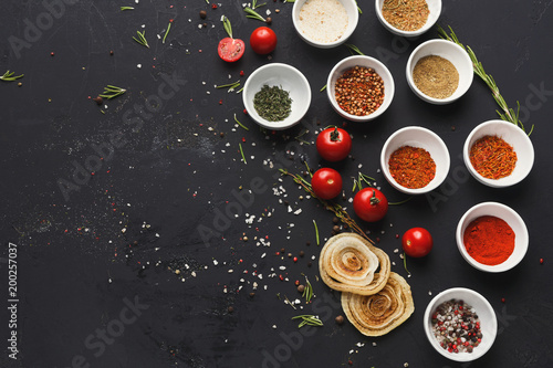 Diverse spices in small cups