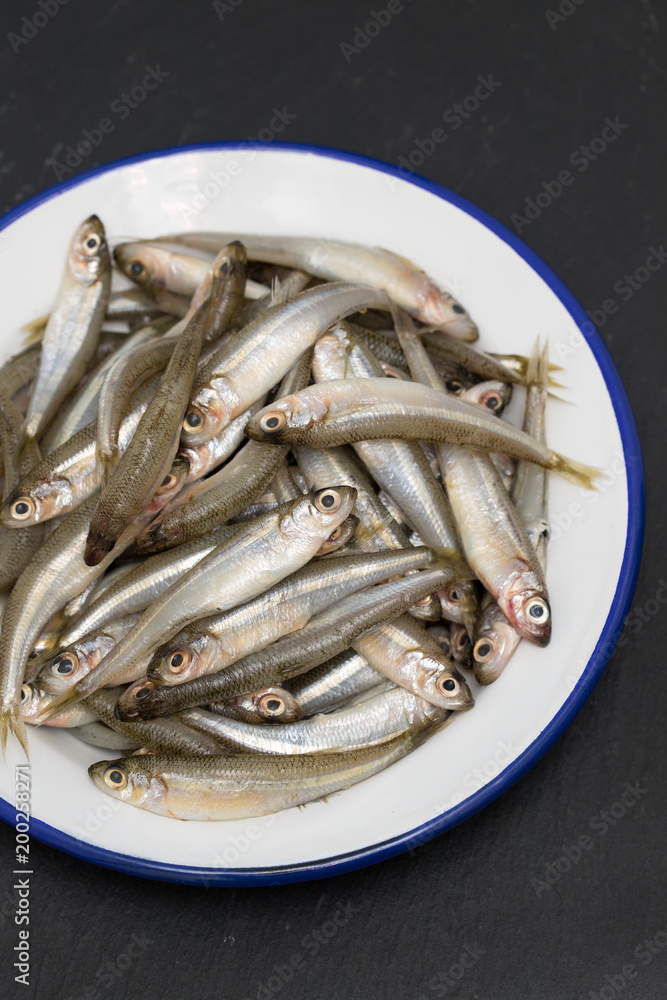 small fish atherina on white dish small fish atherina on white dish