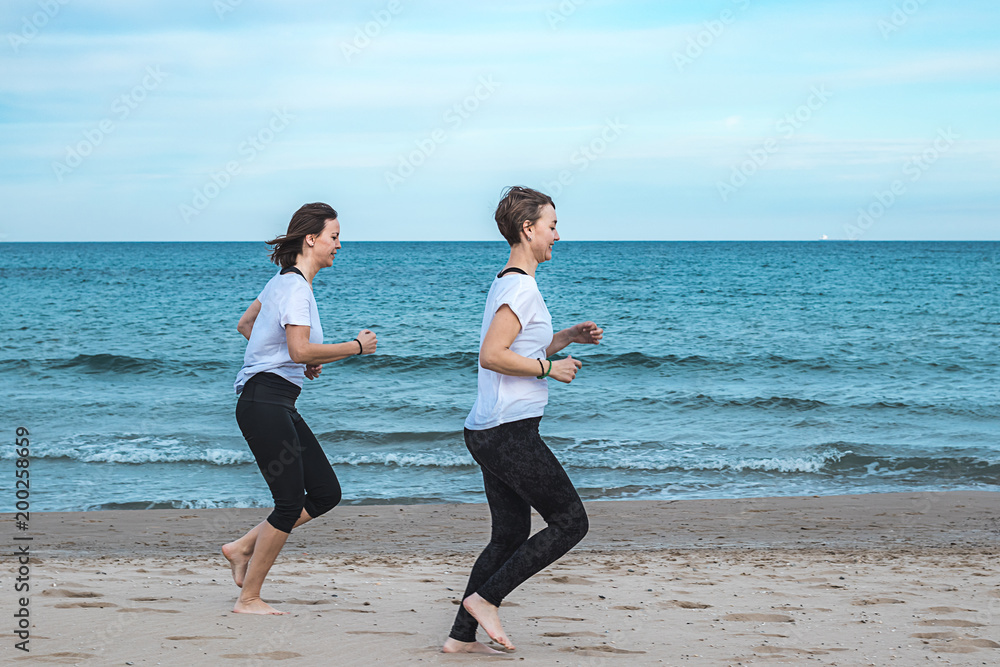 Girls running around the beach Girls running around the beach