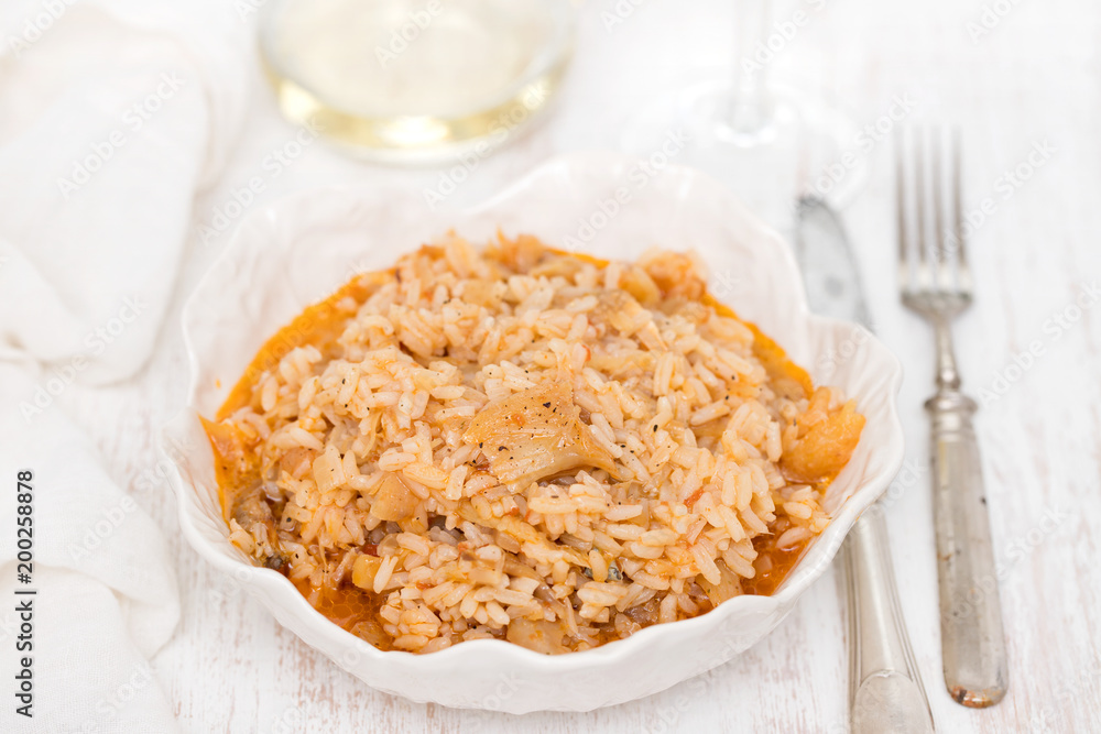 rice wtih cod fish and tomato on beautiful white bowl rice wtih cod fish and tomato on beautiful white bowl