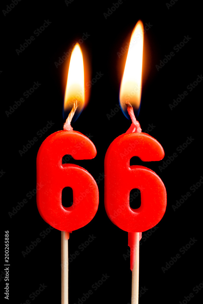 Burning candles in the form of 66 sixty six (numbers, dates) for cake isolated on black background. The concept of celebrating a birthday, anniversary, important date, holiday, table setting Burning candles in the form of 66 sixty six (numbers, dates) for cake isolated on black background. The concept of celebrating a birthday, anniversary, important date, holiday, table setting