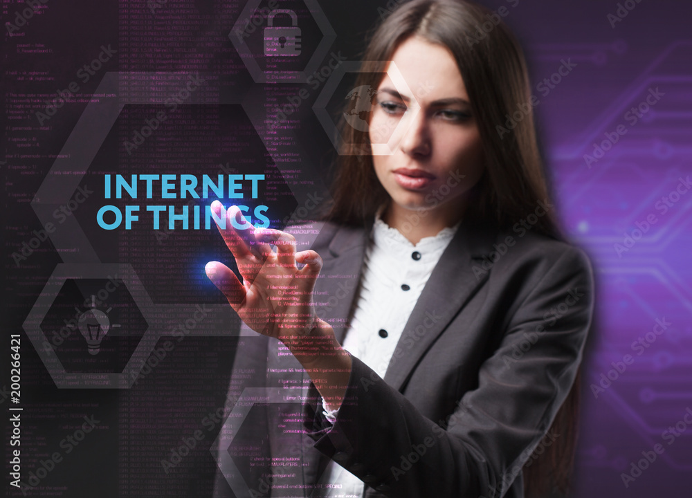 The concept of business, technology, the Internet and the network. A young entrepreneur working on a virtual screen of the future and sees the inscription: Internet of things The concept of business, technology, the Internet and the network. A young entrepreneur working on a virtual screen of the future and sees the inscription: Internet of things