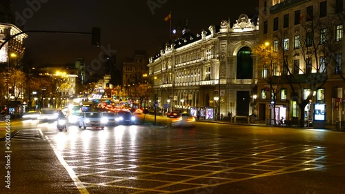 Crossing of streets Alkala and Gran Via in Madrid at night. Timelapse. Night traffic in Madrid. 