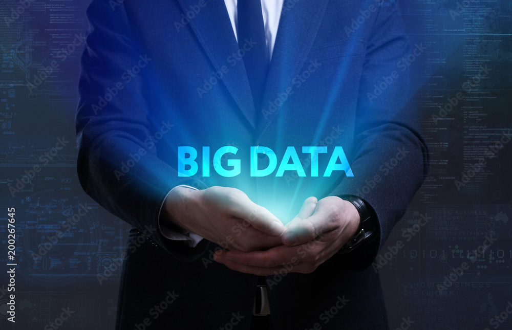Business, Technology, Internet and network concept. Young businessman working on a virtual screen of the future and sees the inscription: Big data Business, Technology, Internet and network concept. Young businessman working on a virtual screen of the future and sees the inscription: Big data