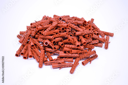 Plastic straddling dowel red white background