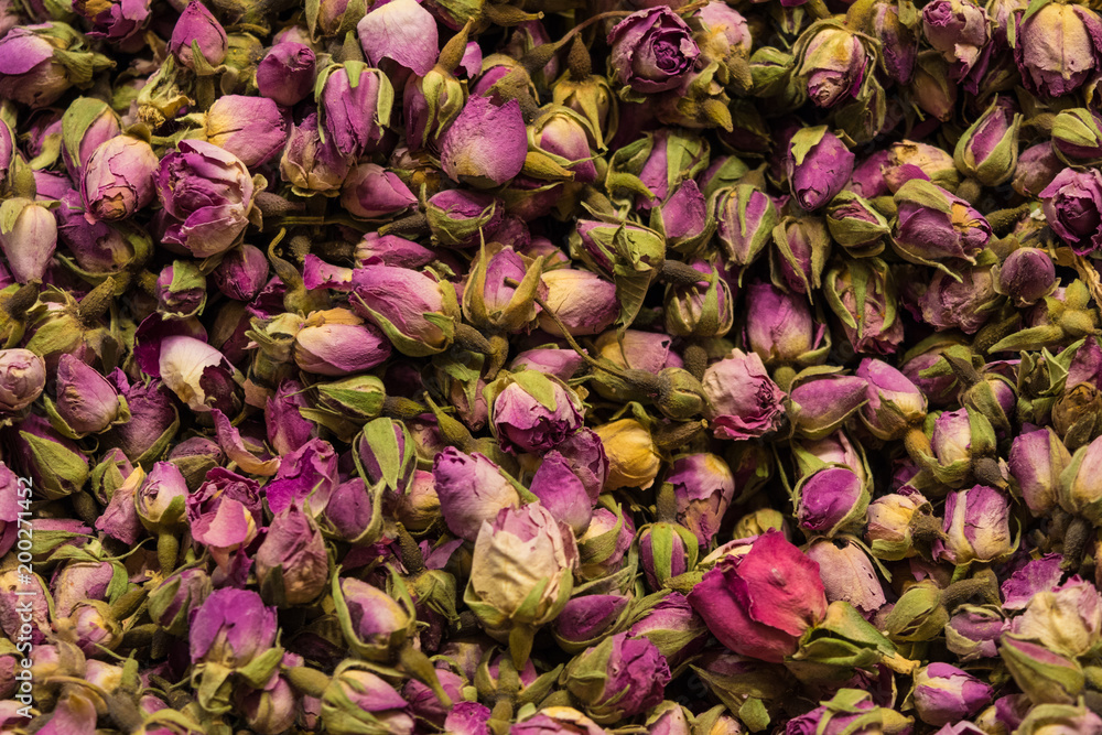 Dried rosebuds background texture closeup. violet rosebud macro close up of heap Dried rosebuds background texture closeup. violet rosebud macro close up of heap