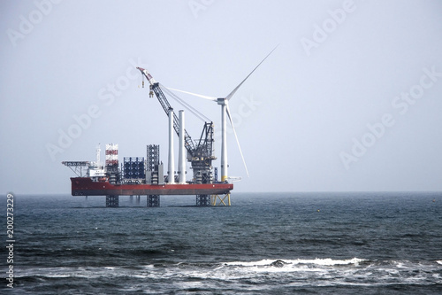 The largest wind farm installation vessel in the world and the first turbine installed off the coast of Aberdeen. Balmedie, Aberdeenshire, Scotland, UK. April 11th 2018
