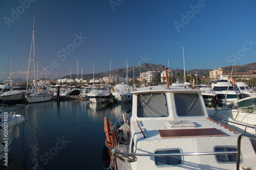 Boats at the port during a nice summer day with a cloudless blue sky