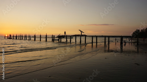 wooden jetty in the sunset