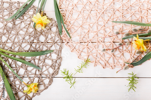 Fototapeta Naklejka Na Ścianę i Meble -  Spring floral border, beautiful fresh daffodils flowers, pussy-willow, hearts isolated on white background. Backdrop with copy space, flat lay, top view. Easter, Mothers, Women's, Wedding Day concept