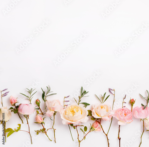 Fototapeta Naklejka Na Ścianę i Meble -  Festive flower English rose composition on the white background. Overhead top view, flat lay. Copy space. Birthday, Mother's, Valentines, Women's, Wedding Day concept.