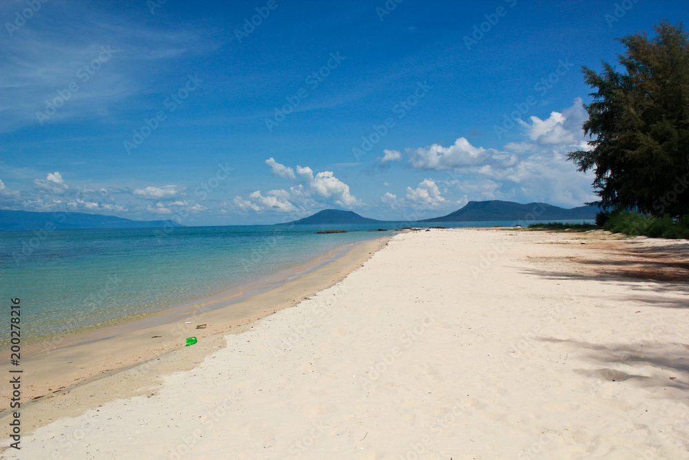 Empty beach with white sand and clear water