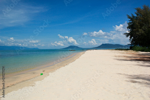 Empty beach with white sand and clear water