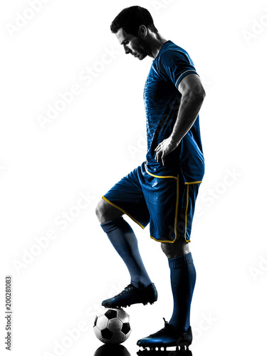 one caucasian soccer player man playing in silhouette isolated on white background © snaptitude