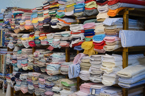 colorful fabrics on the shelf in the store