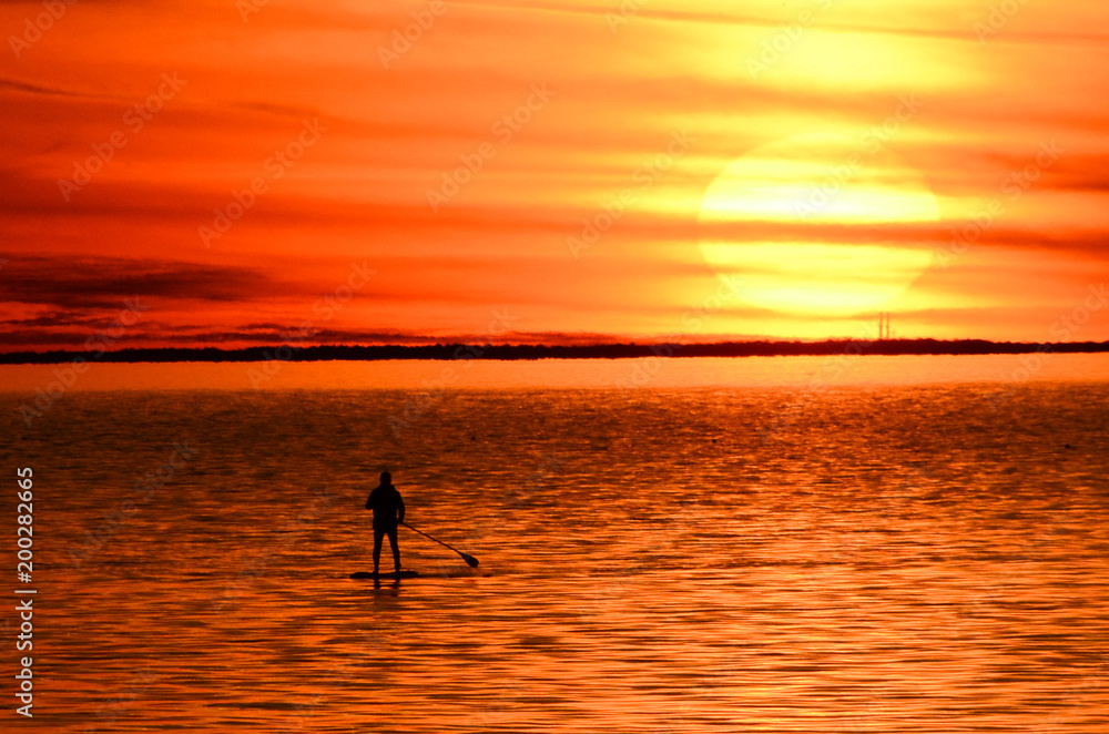 Paddle Boarder at Sunset on Bay