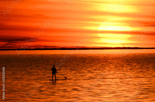 Paddle Boarder at Sunset on Bay © Barry
