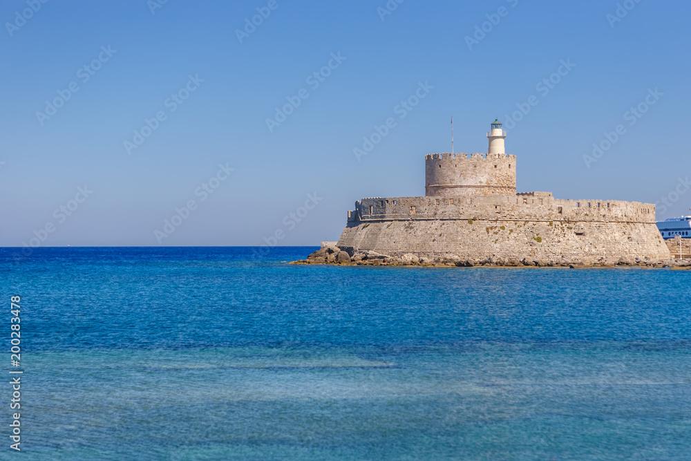 Lighthouse of St. Nicholas and Gates of the Harbor in Rhodes, Greece.