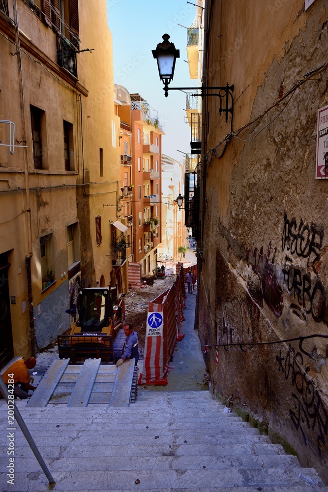 Fototapeta premium Workmen in the narrow streets
