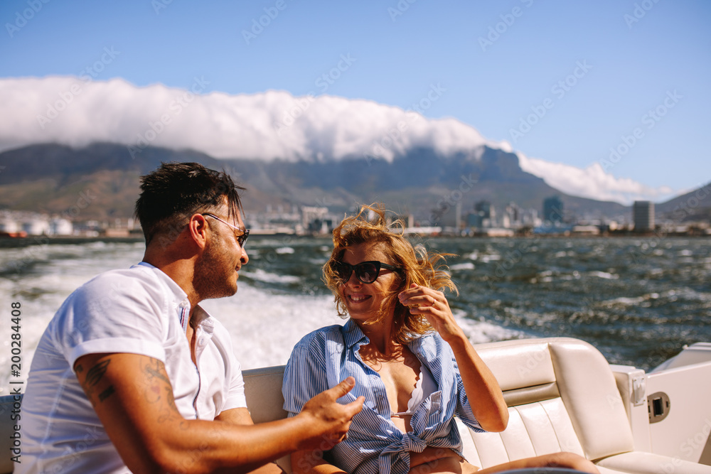 Young couple hanging out in a yacht