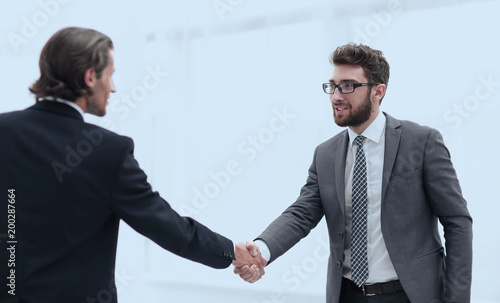 welcome and handshake of business partners