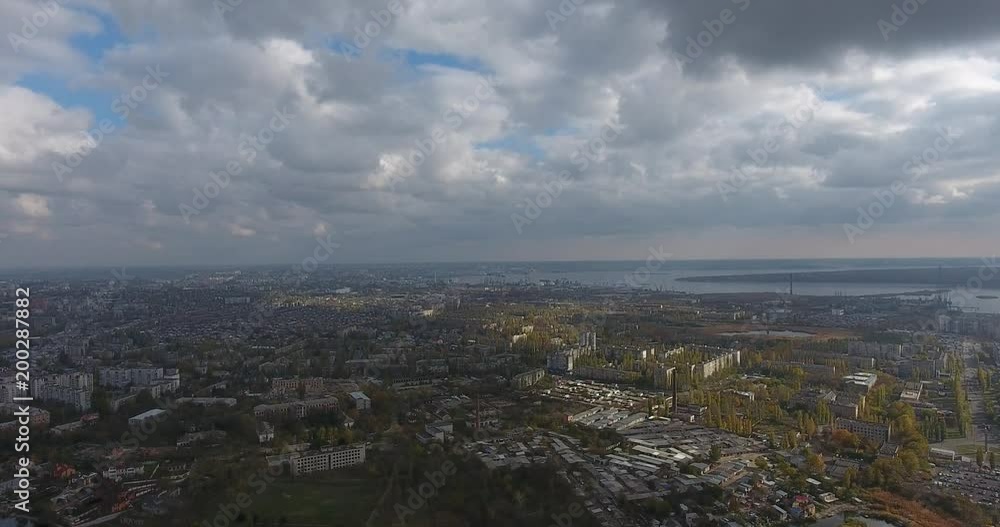 Aerial View of the city amongst thunderstorm clouds before a thunder and rain Aerial View of the city amongst thunderstorm clouds before a thunder and rain