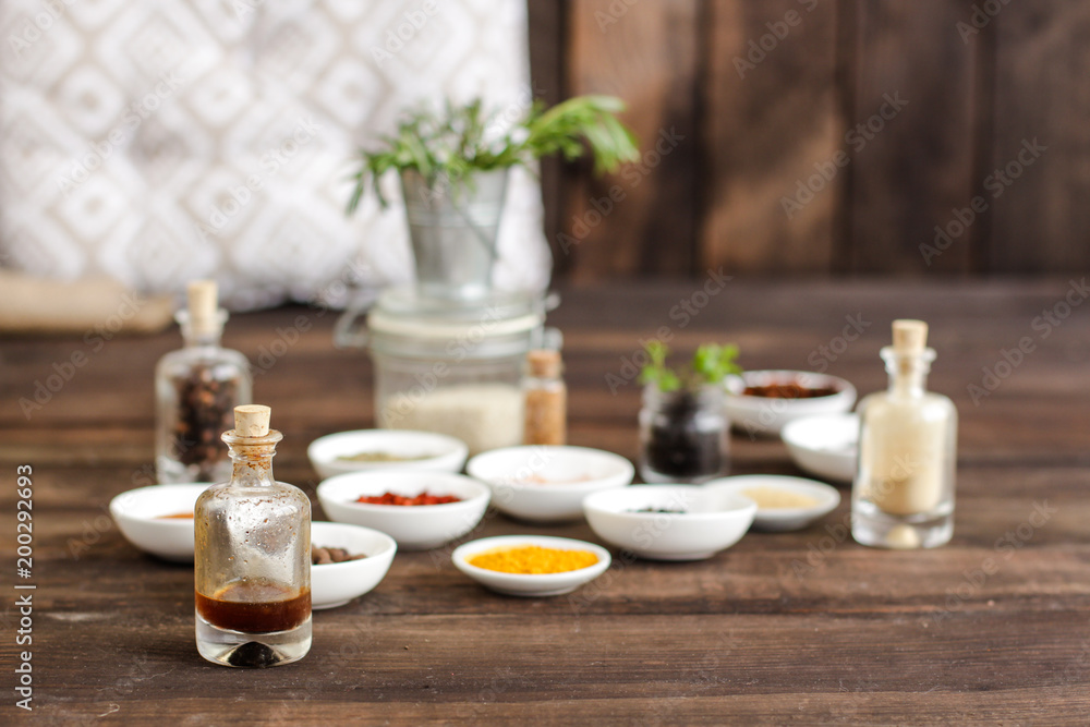 Spices and herbs. Variety of spices and herbs on a dark wooden surface Spices and herbs. Variety of spices and herbs on a dark wooden surface