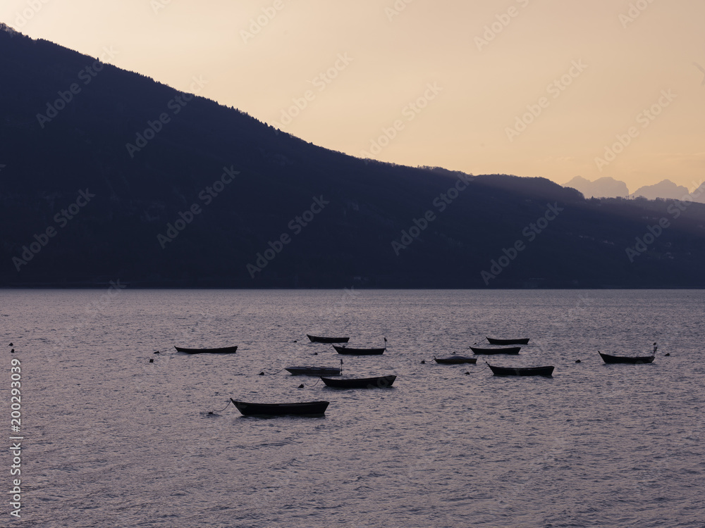 Mountain lake and moored boats