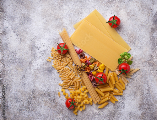 Various type of pasta and cherry tomato photo