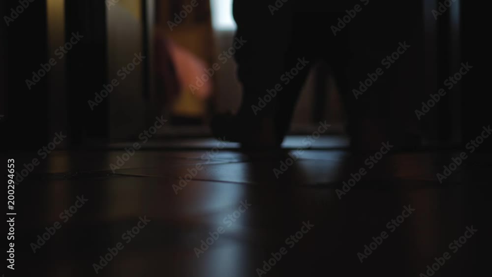 Closeup legs of little child walking by herself on the carpet in the kids room. Closeup legs of little child walking by herself on the carpet in the kids room.