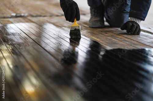 worker paints the metal