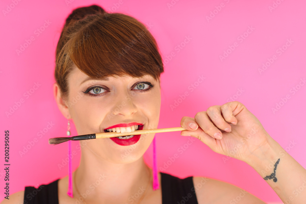 Beauty Girl Face with Colorful lips. Colourful Studio Shot of young Woman. Vivid Colors. Colourful fashion Makeup. Beautiful lady touching her face Beauty Girl Face with Colorful lips. Colourful Studio Shot of young Woman. Vivid Colors. Colourful fashion Makeup. Beautiful lady touching her face