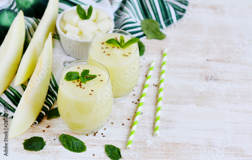 Cold fresh melon smoothies with mint in glass  summer drink beverage  healthy food concept  freshness  exotic fruits