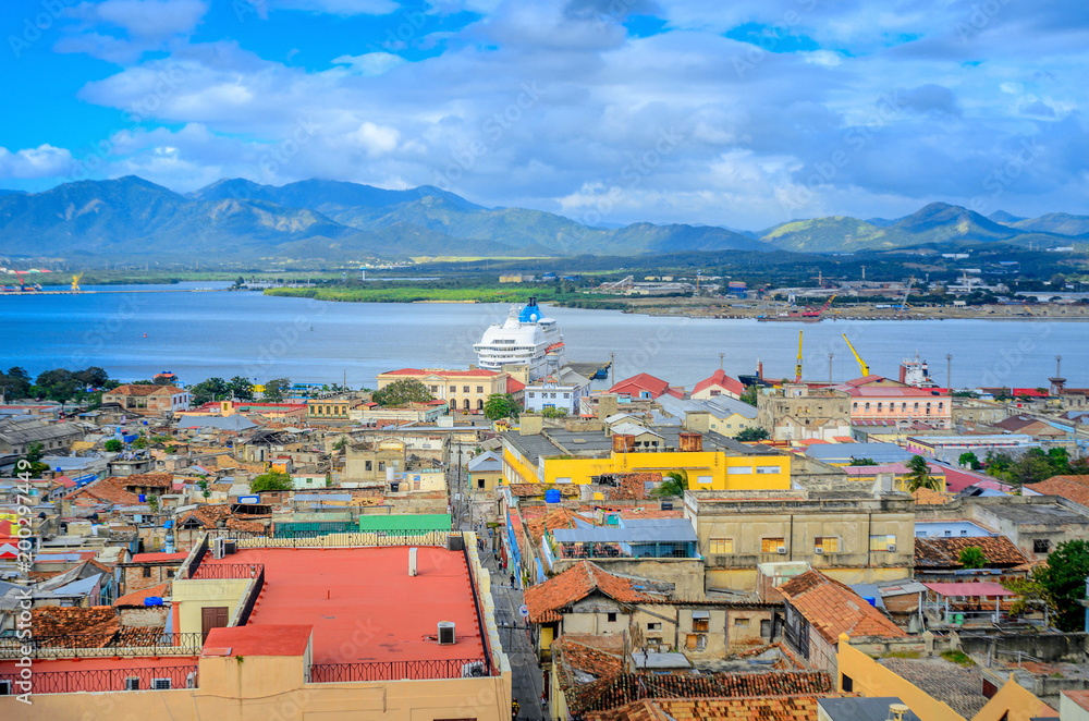 Fototapeta premium view from the air to the old Cuban port city, a large cruise liner stands at the pier