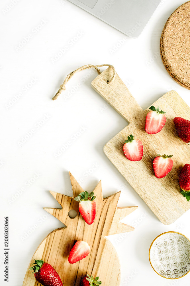 Strawberry on cutting board on white background. Flat lay, top view. Strawberry on cutting board on white background. Flat lay, top view.