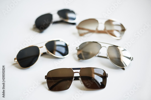 Various stylish fashionable sunglasses isolated on white background