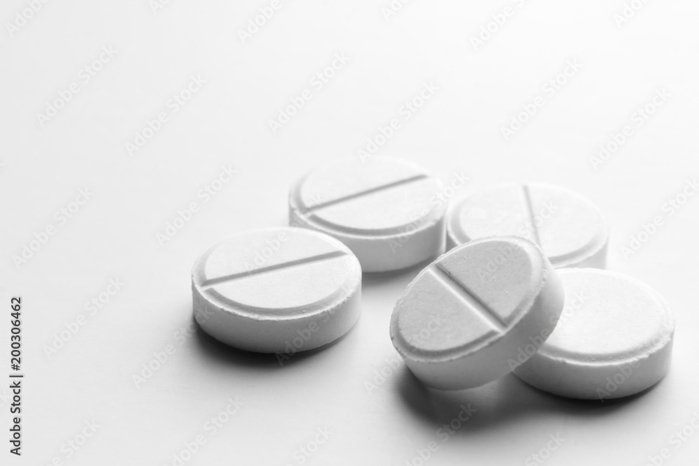 Piles of pills and capsule on white background, isolated. Selective focus Piles of pills and capsule on white background, isolated. Selective focus