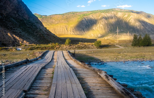 Mountain landscape. The automobile bridge across the Chuya River in the Altai Republic.