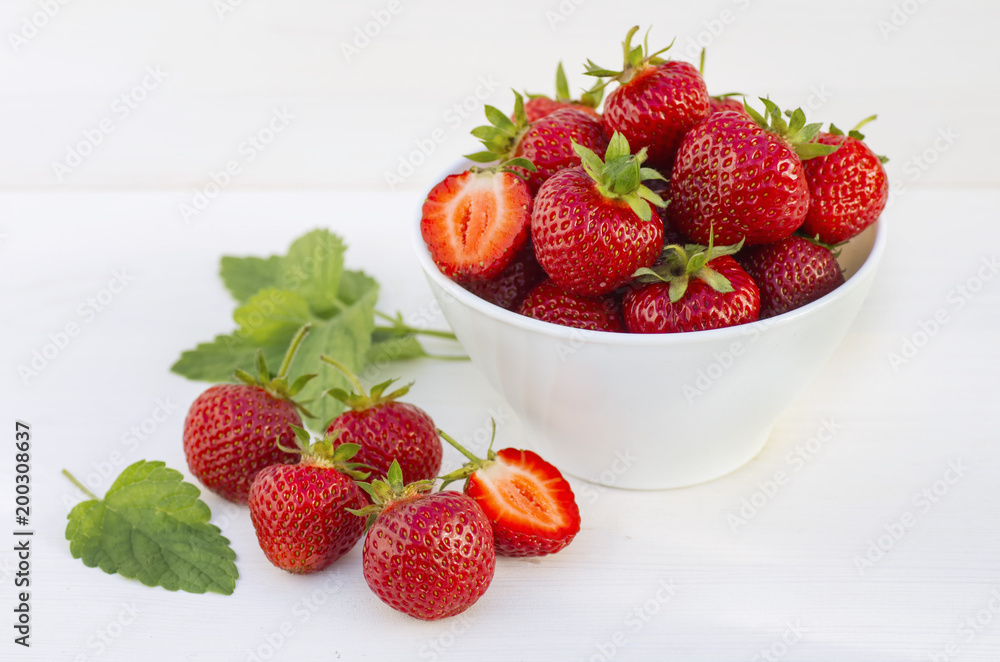 ripe strawberry on a table in a white plate ripe strawberry on a table in a white plate