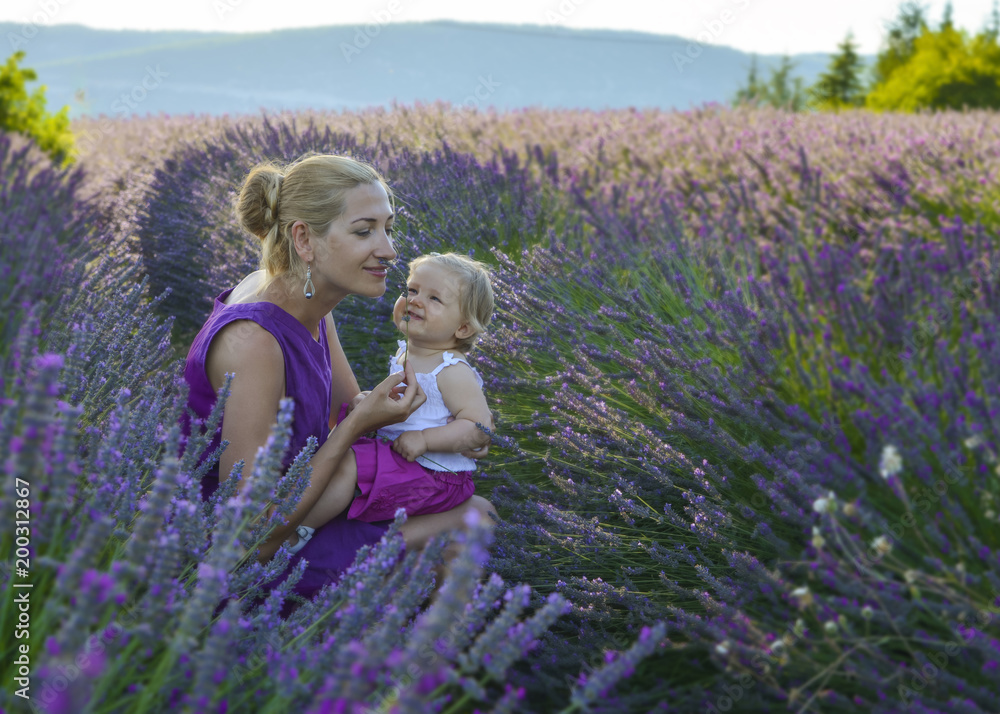 Mother and daughter in a lavender field Mother and daughter in a lavender field