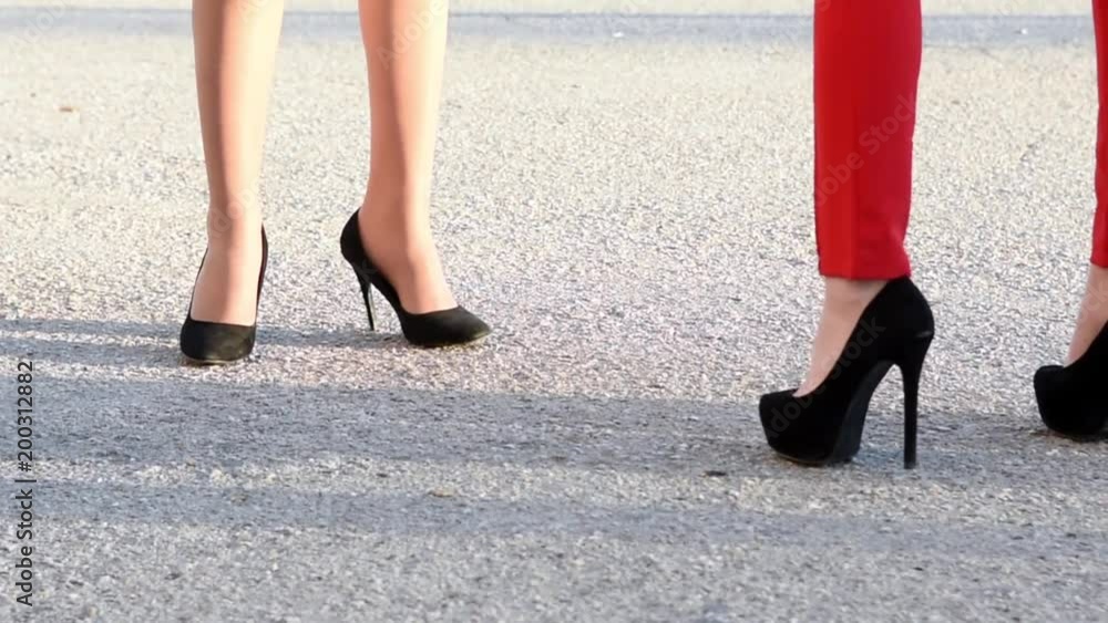 legs of girls with heels are chilling around legs of girls with heels are chilling around